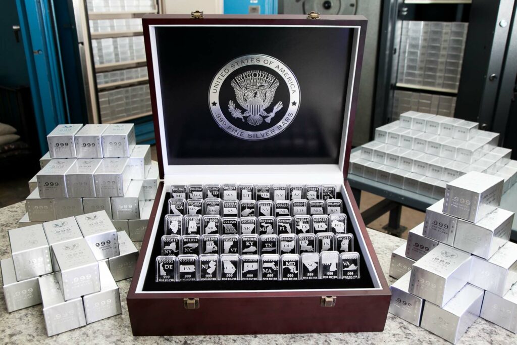 Wooden Display Chest with All 50-States Silver Bars, One of Each State, .999 Fine Silver, Front View with Vault in Background